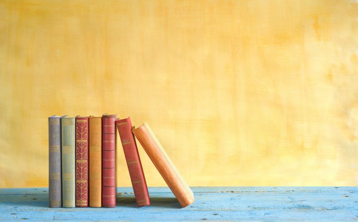 row of books, grungy background, free copy space